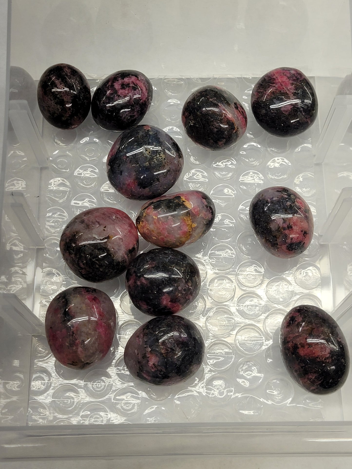 Icy Rhodonite tumbles