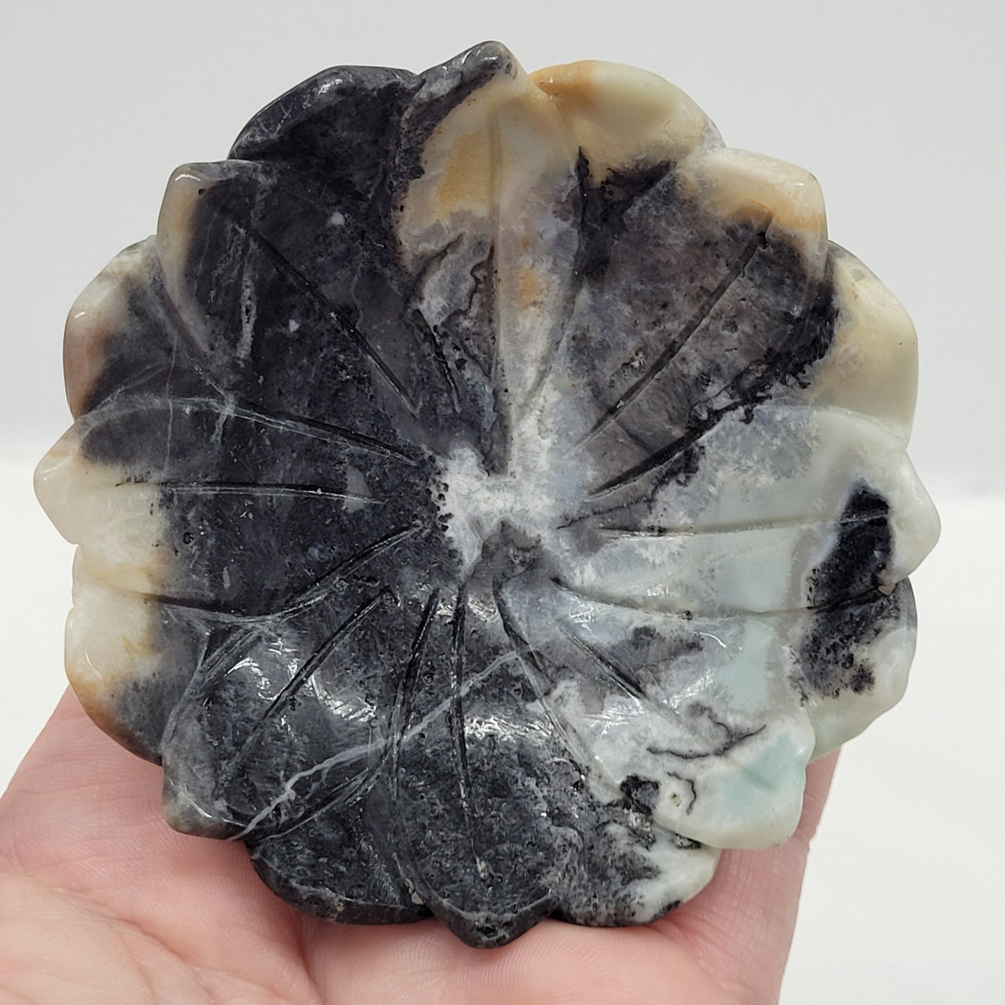 Caribbean Calcite lotus shaped bowl with tan, blue and black coloring