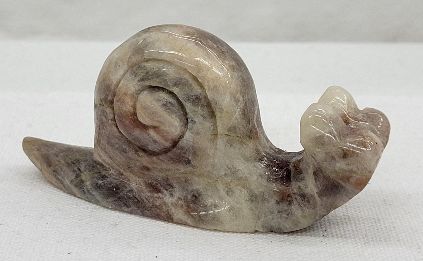 Moonstone snail carving