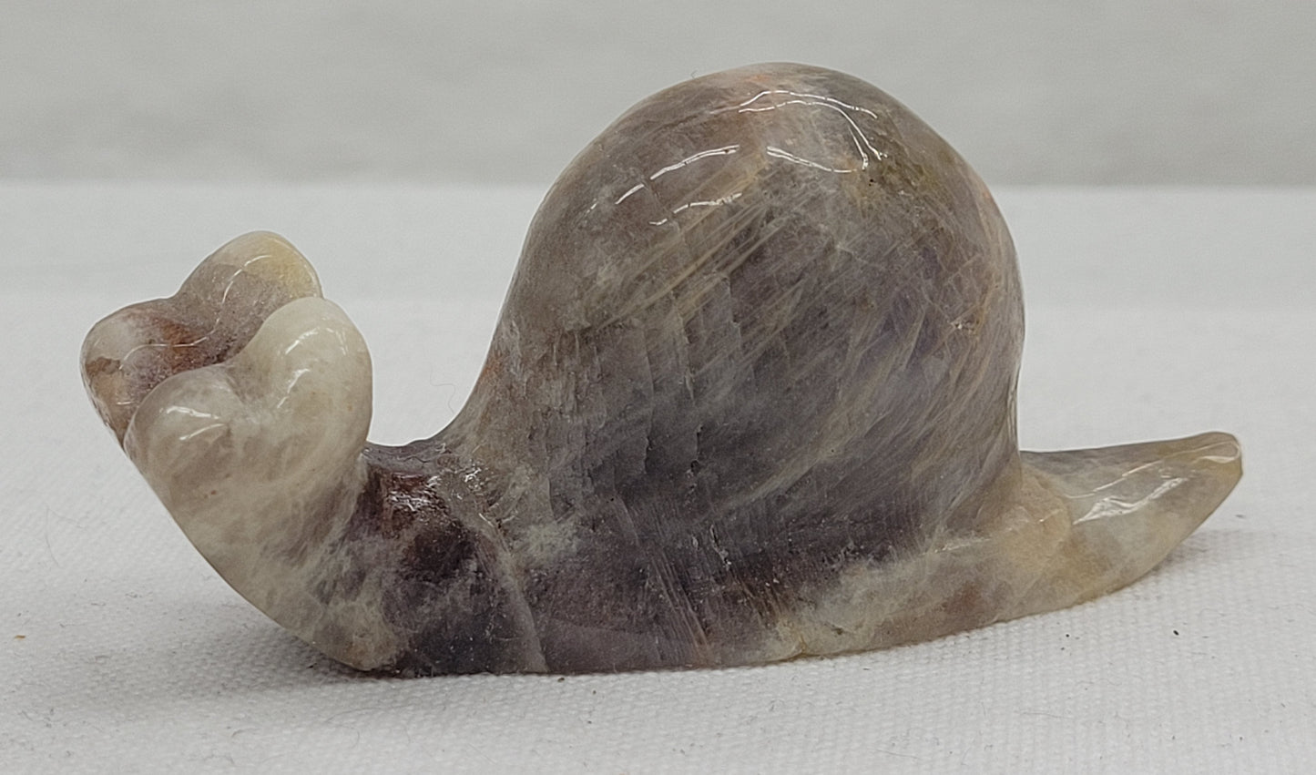 Moonstone snail carving