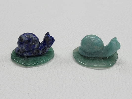 Snail on lily pad carving