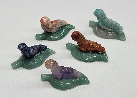 Caterpillar on leaf/lily pad carvings