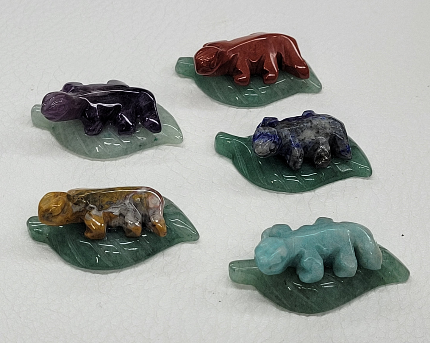 Lizard on lily pad/leaf carvings