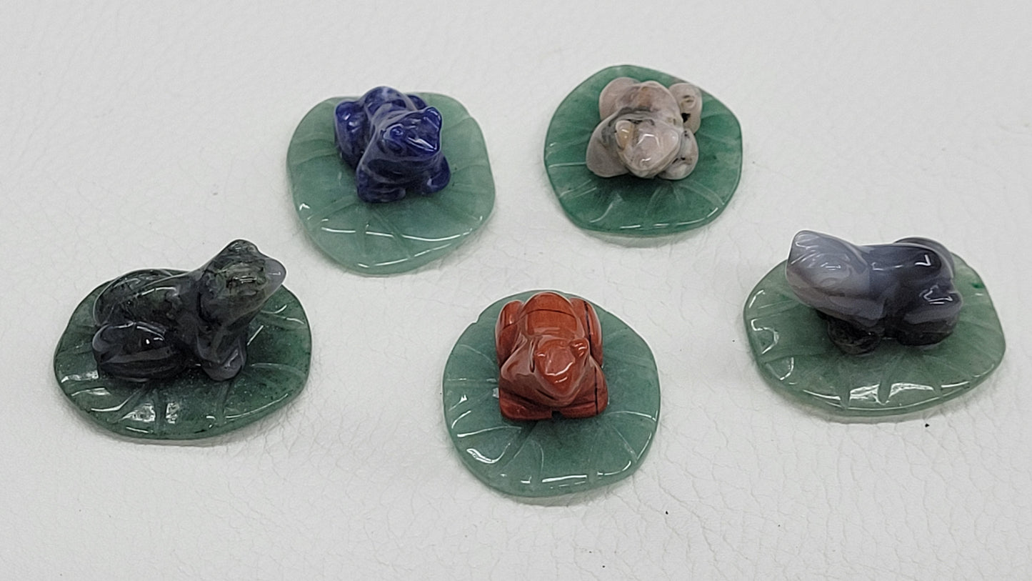 Frog on lily pad carvings