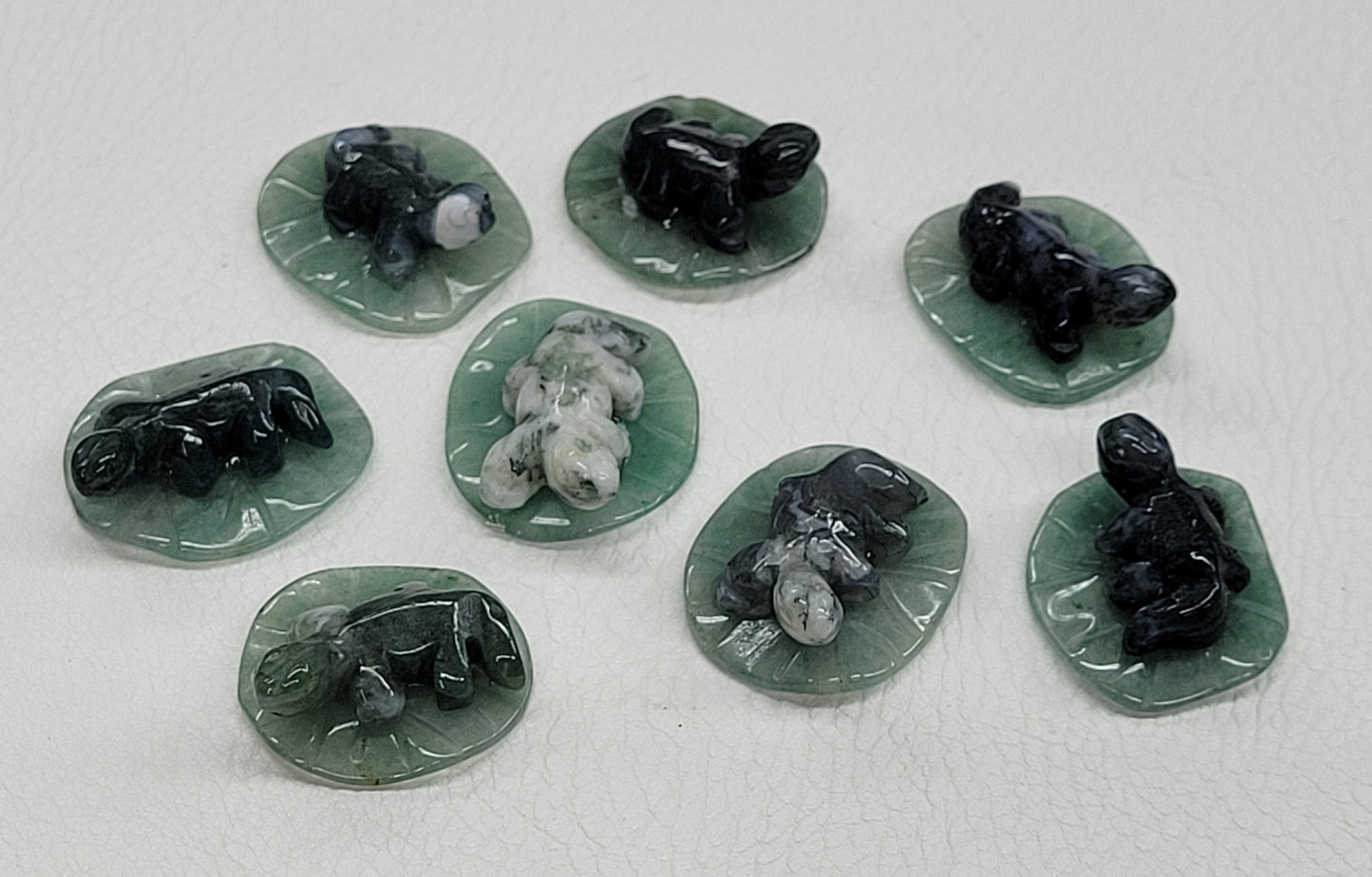 Lizard on lily pad/leaf carvings