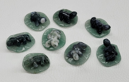 Lizard on lily pad/leaf carvings