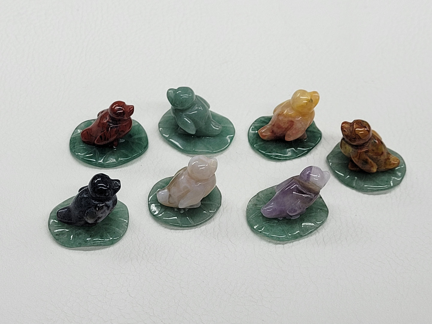 Duck on lily pad carvings