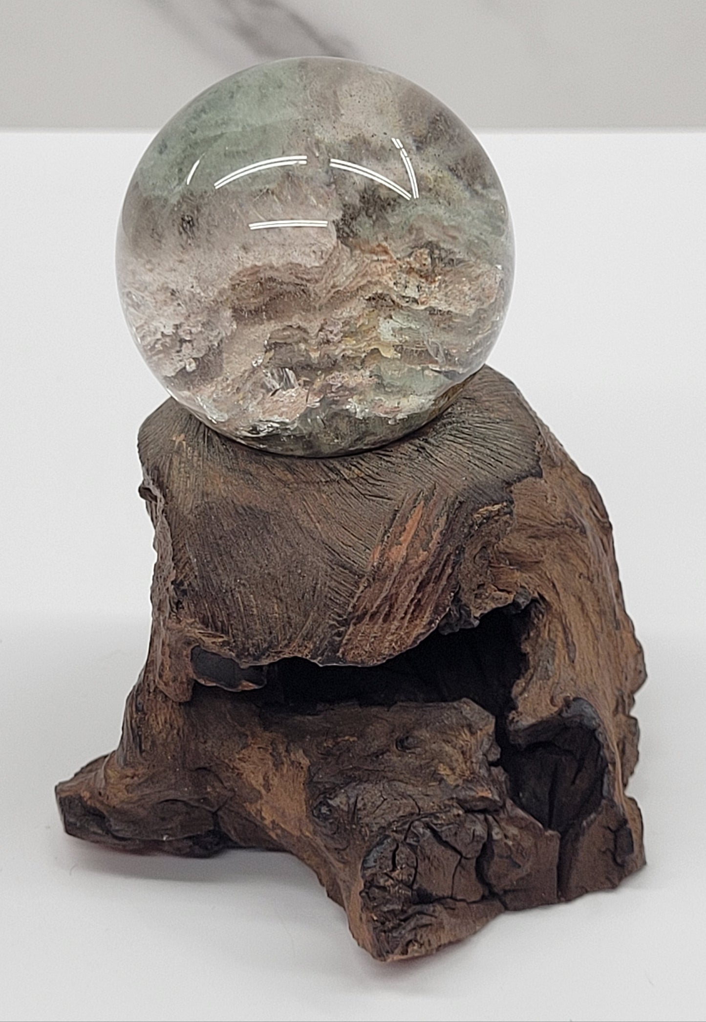 Garden Quartz statement sphere on driftwood stand