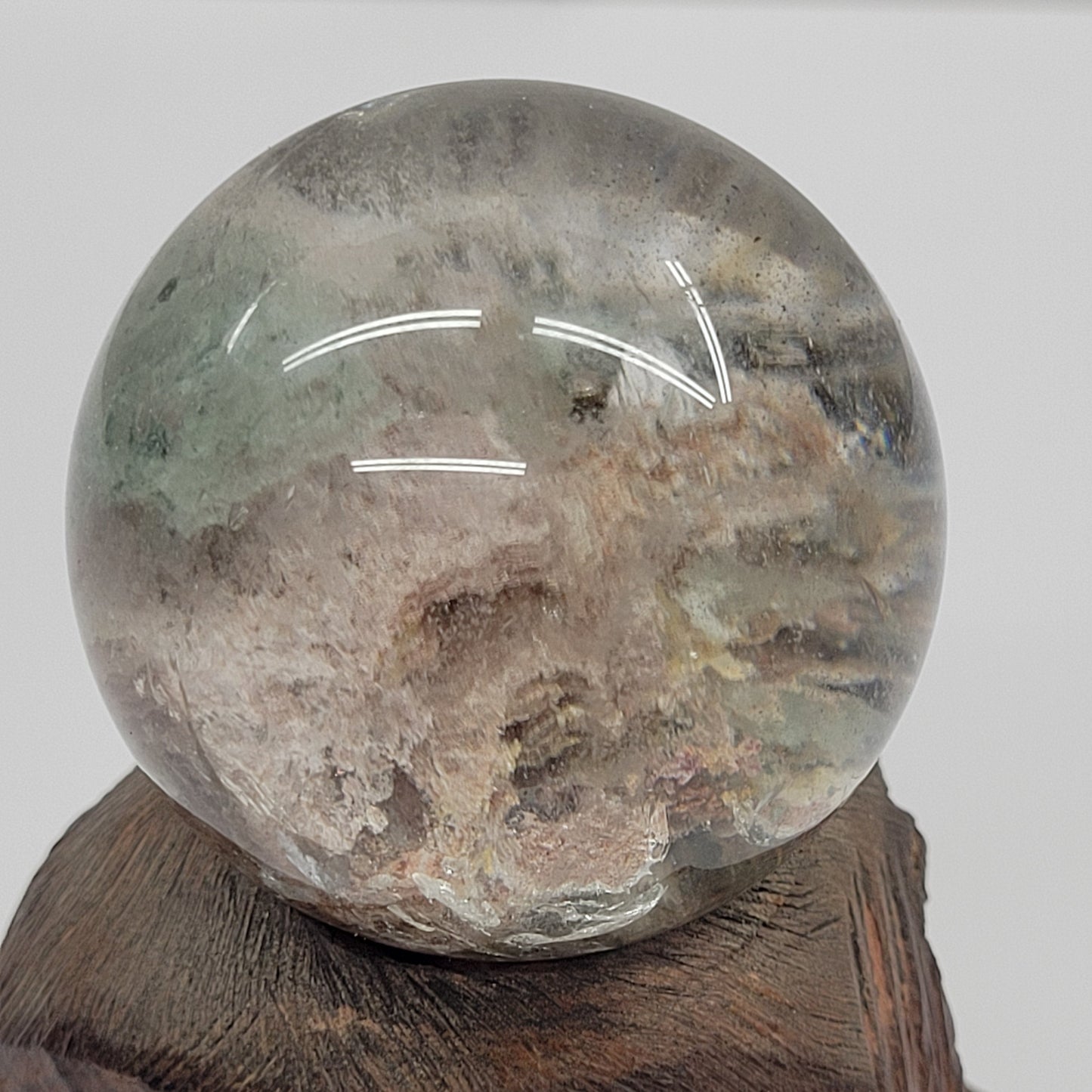 Garden Quartz statement sphere on driftwood stand