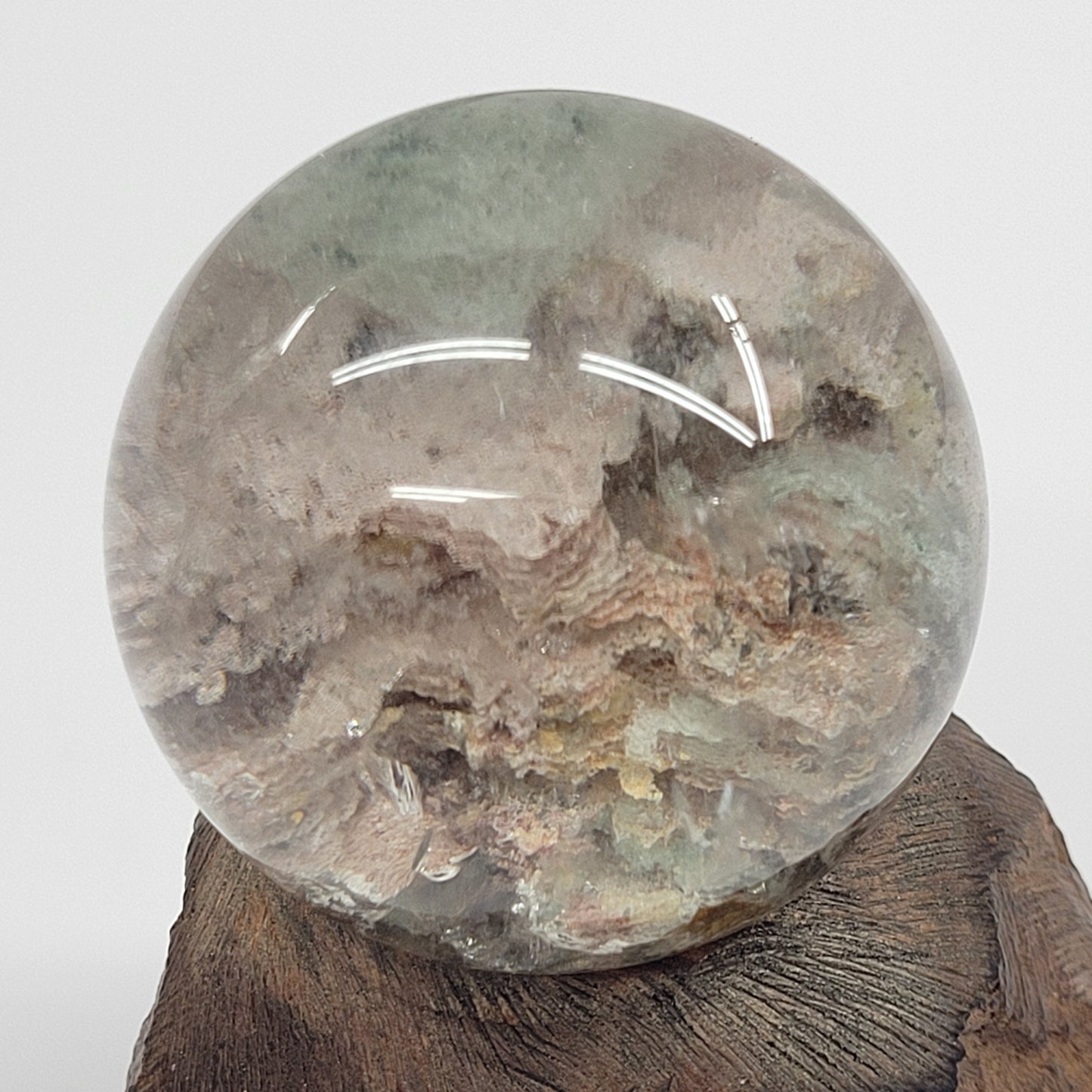 Garden Quartz statement sphere on driftwood stand