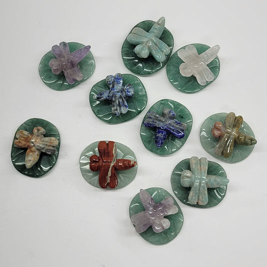 Dragonfly on lily pad carvings