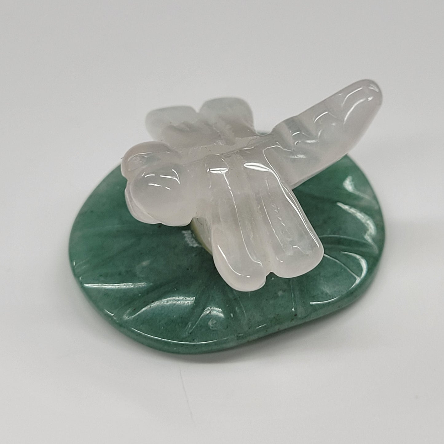Dragonfly on lily pad carvings