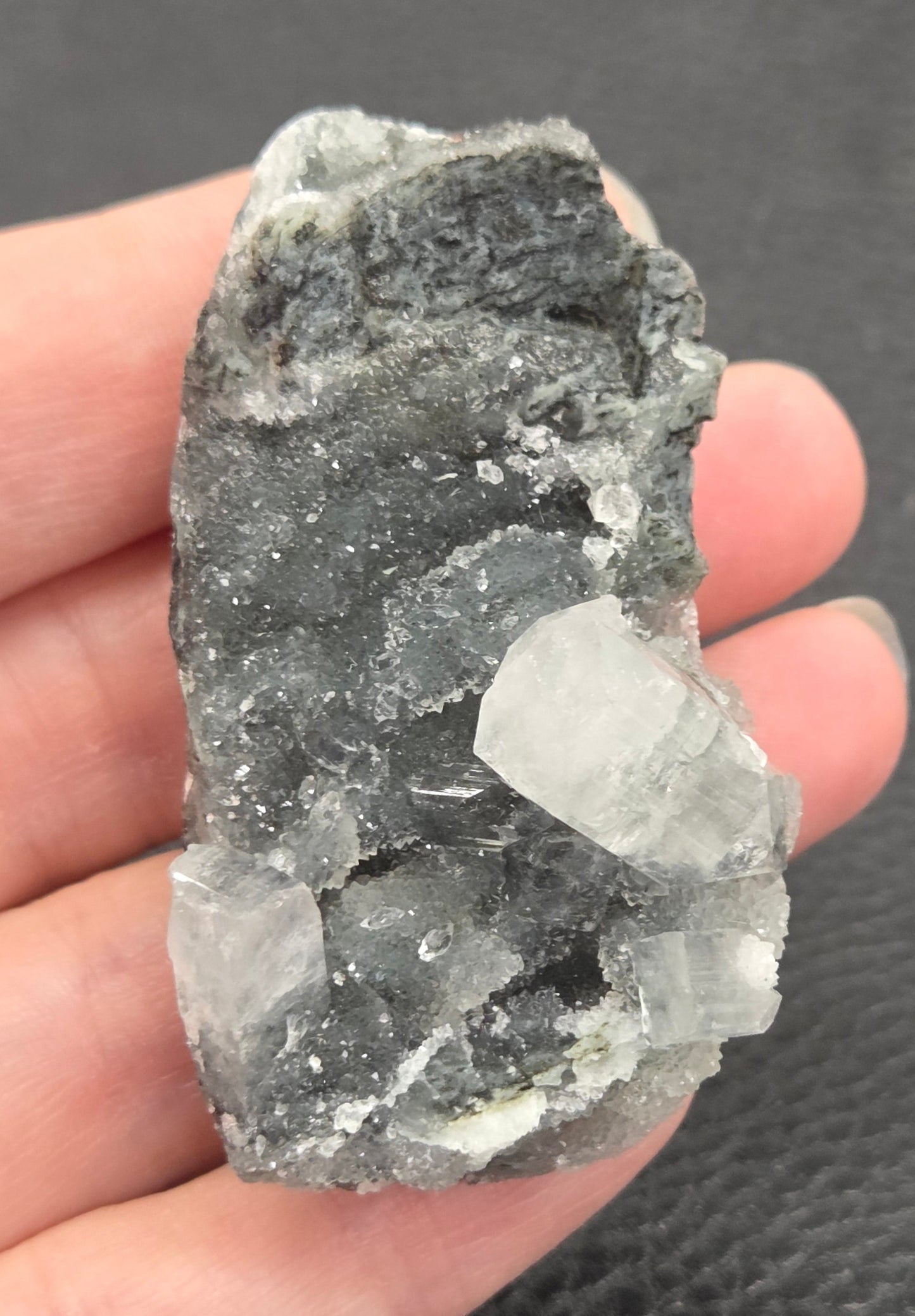 Apophyllite specimens with translucent, clear crystals on a grey crystal matrix