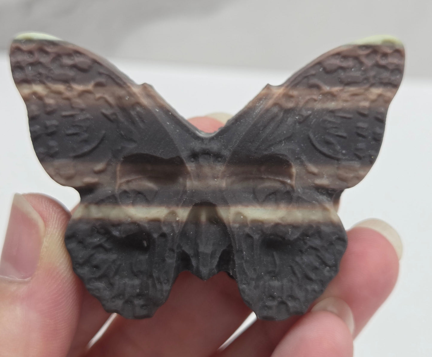 Skull moth carving