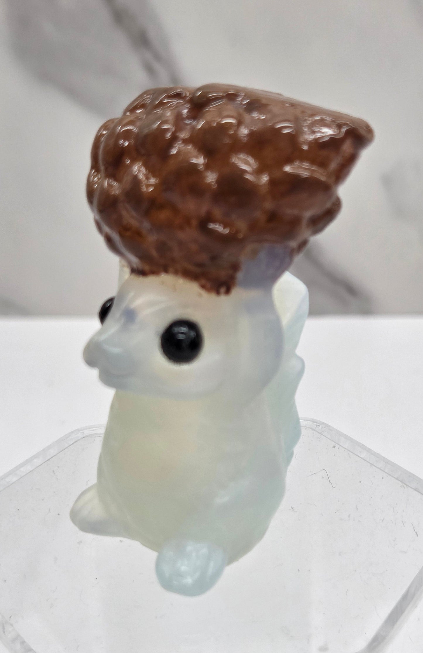 Squirrel holding nut carving