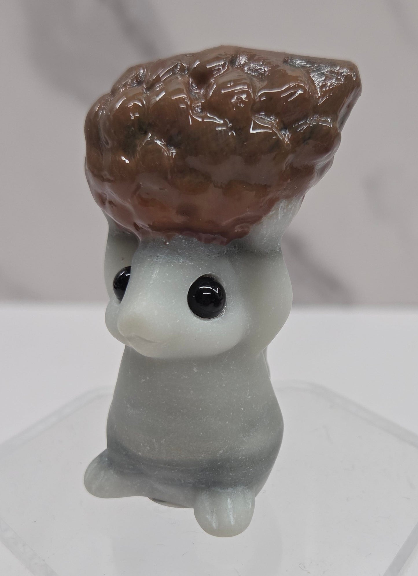 Squirrel holding nut carving