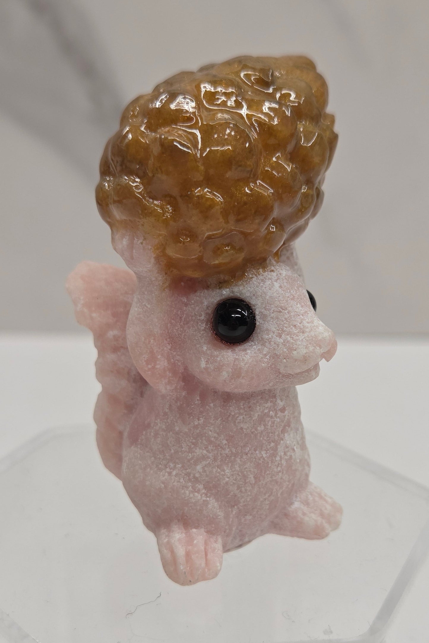 Squirrel holding nut carving