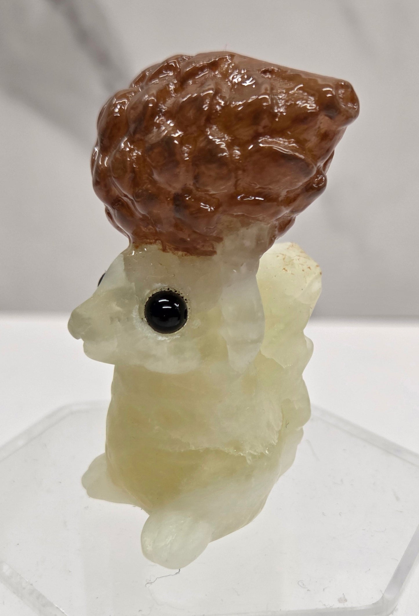 Squirrel holding nut carving