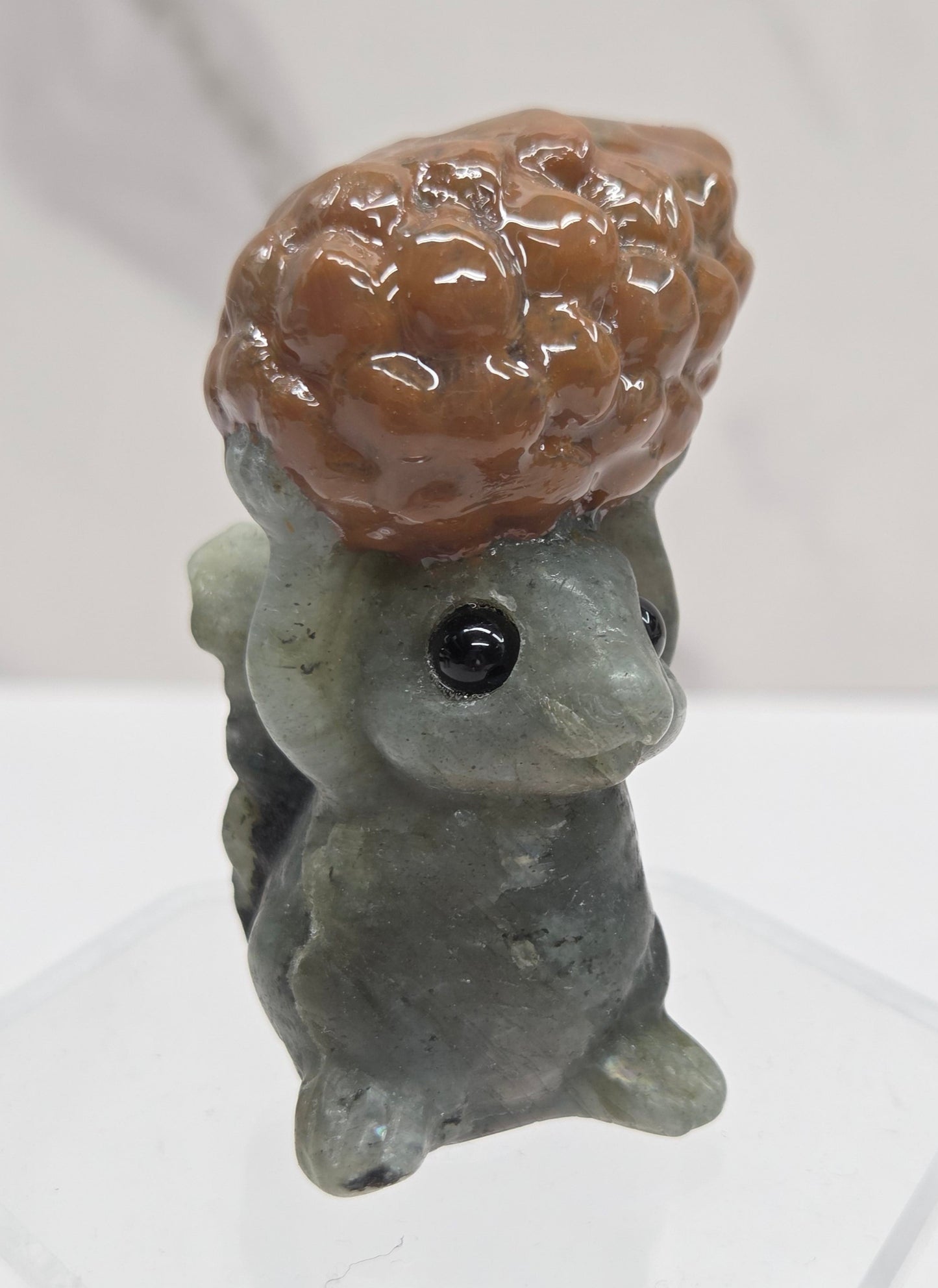 Squirrel holding nut carving