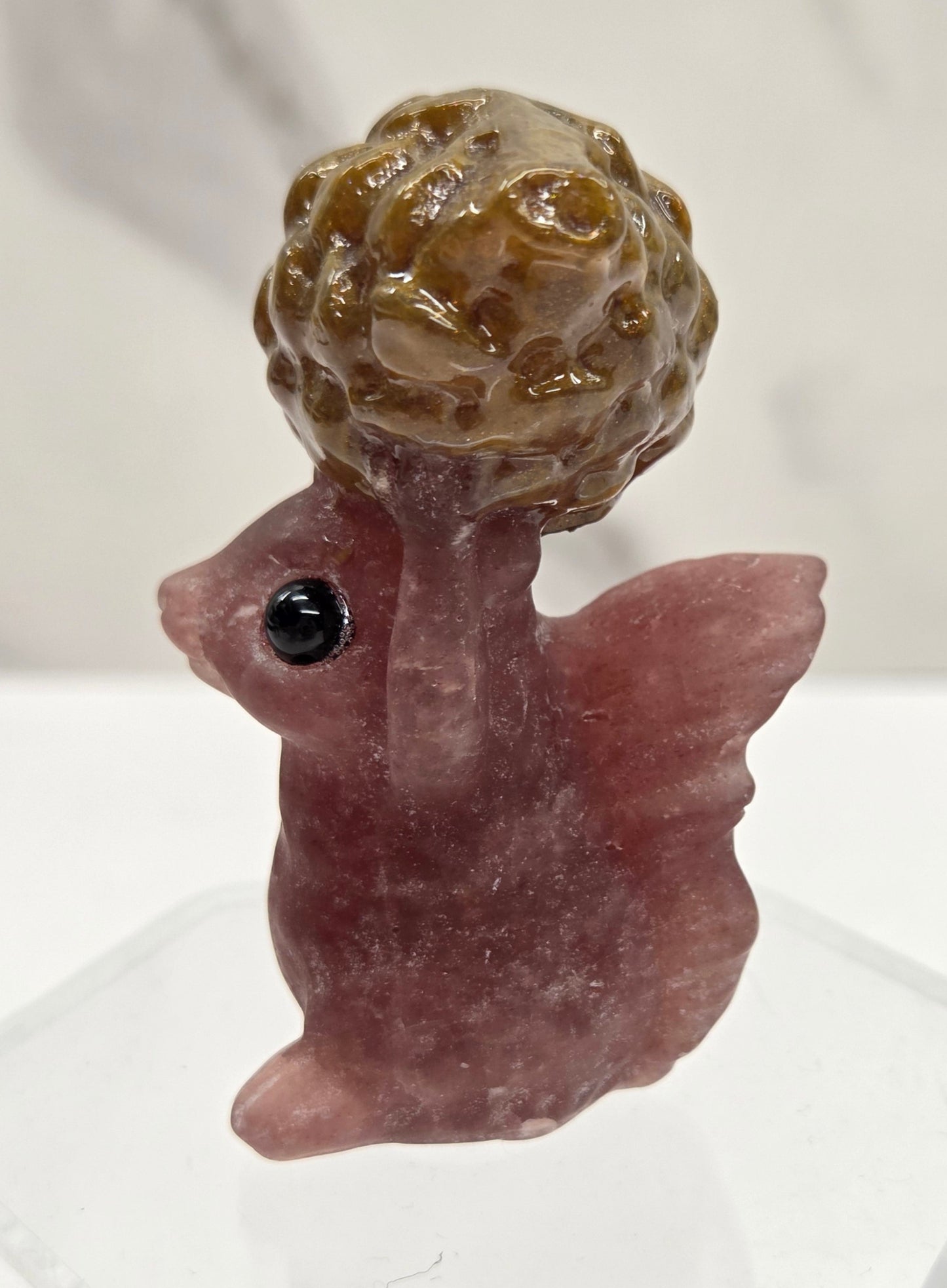 Squirrel holding nut carving