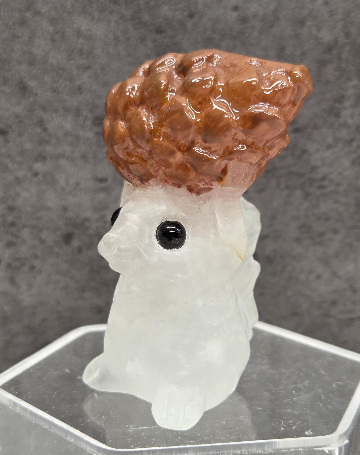 Squirrel holding nut carving