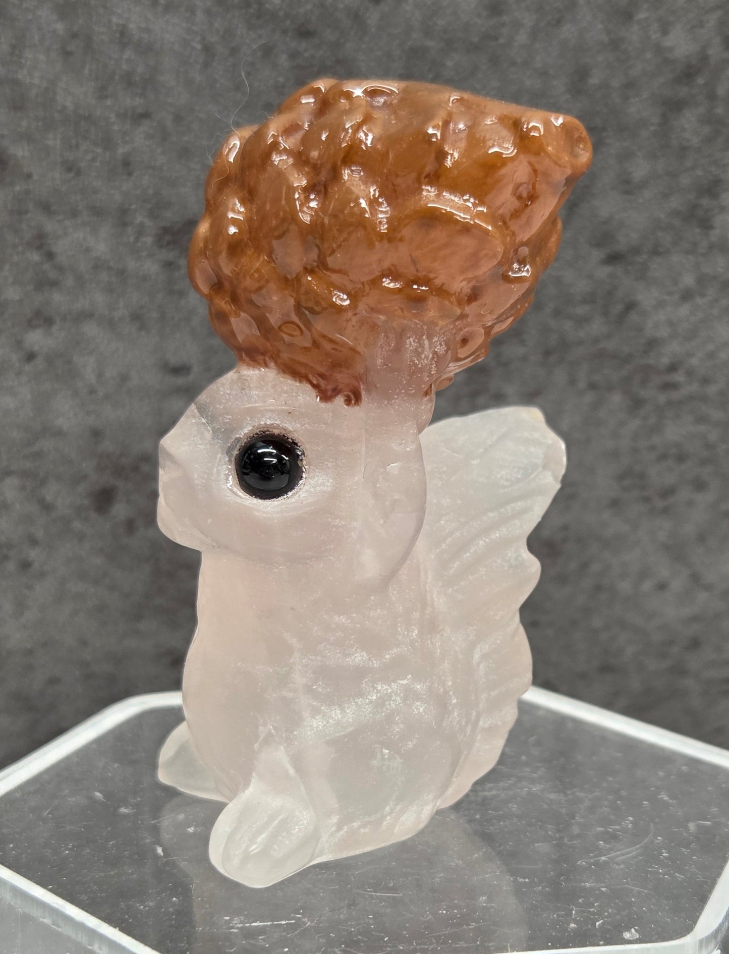 Squirrel holding nut carving