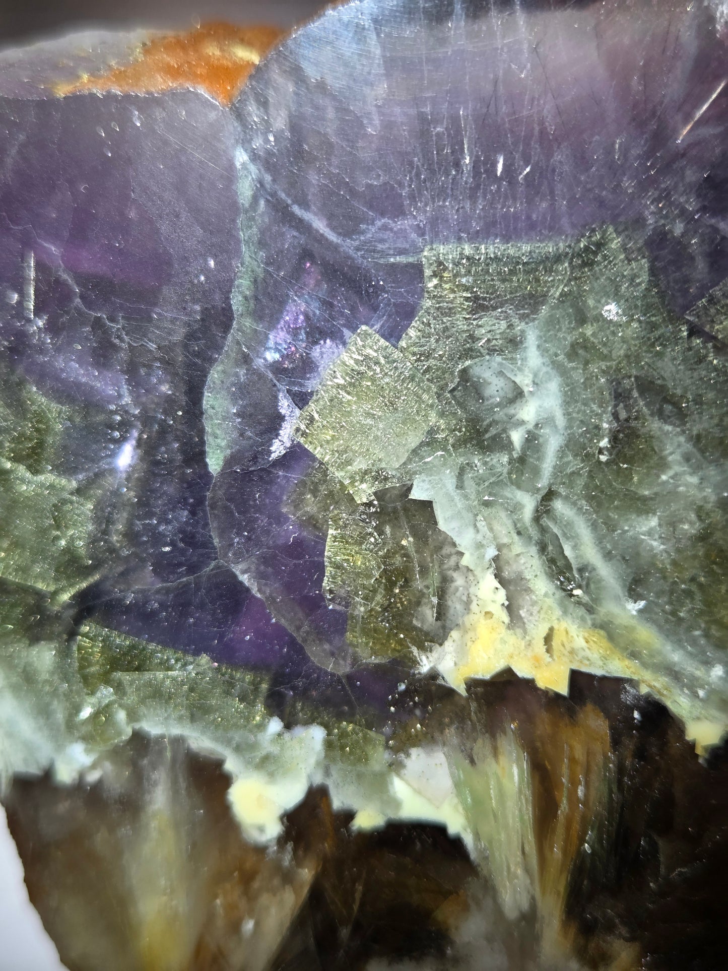 Close-up of a crystal with purple and green colors