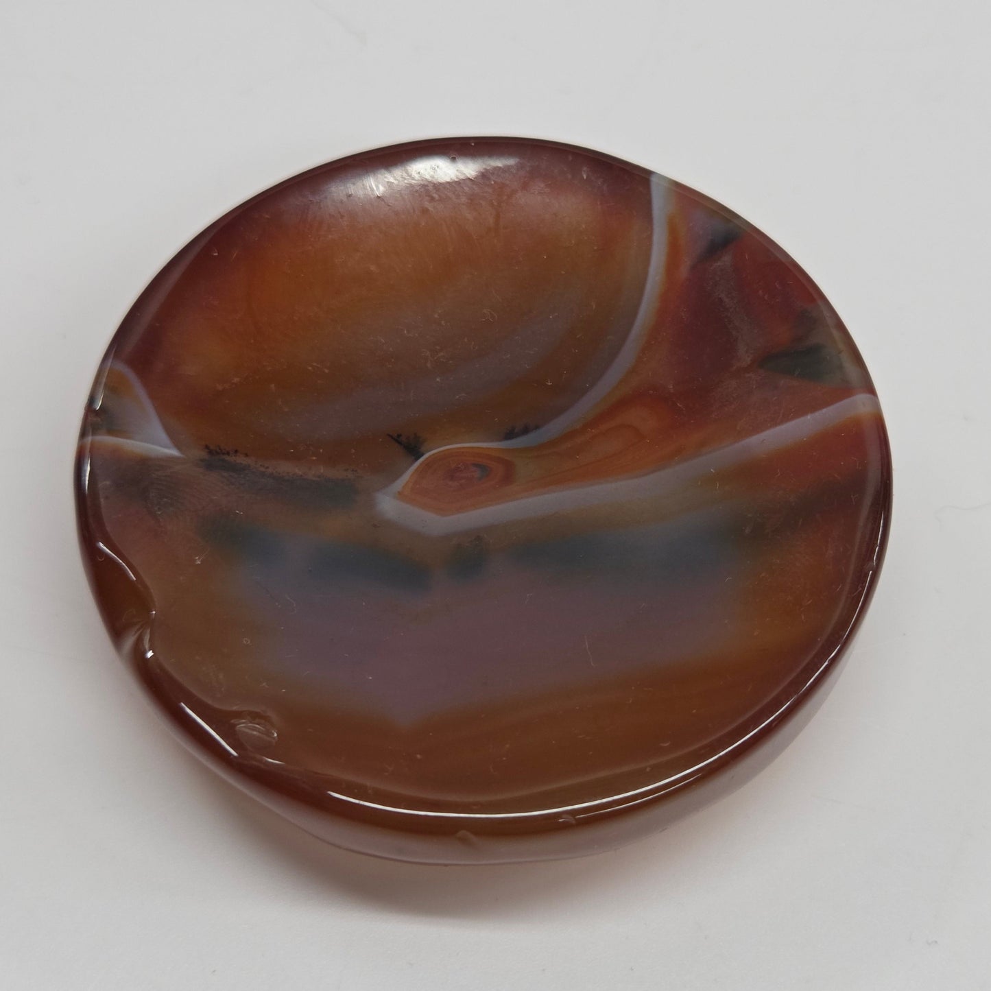 Round brown agate stone on a white background