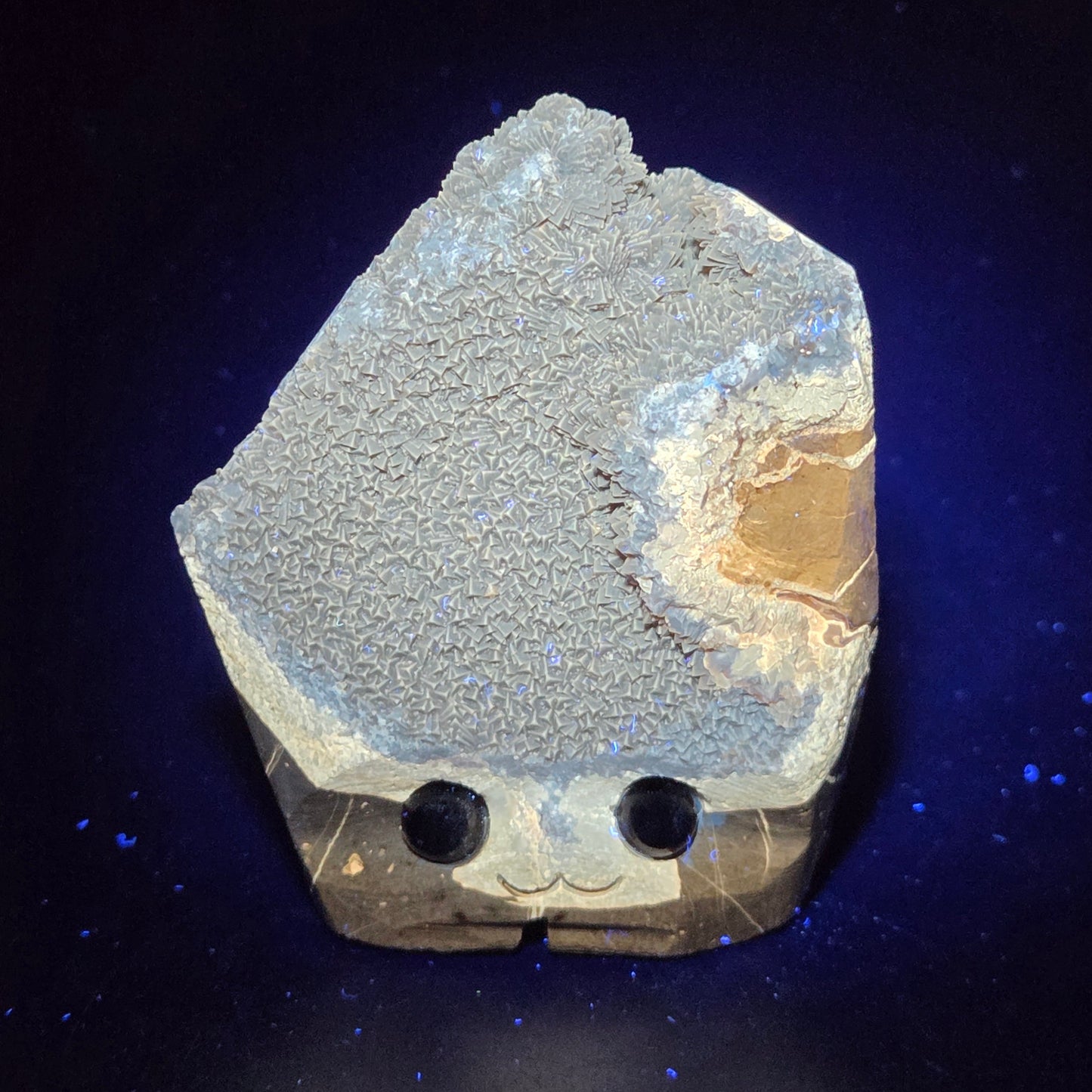 Geode with crystal formation on a dark background