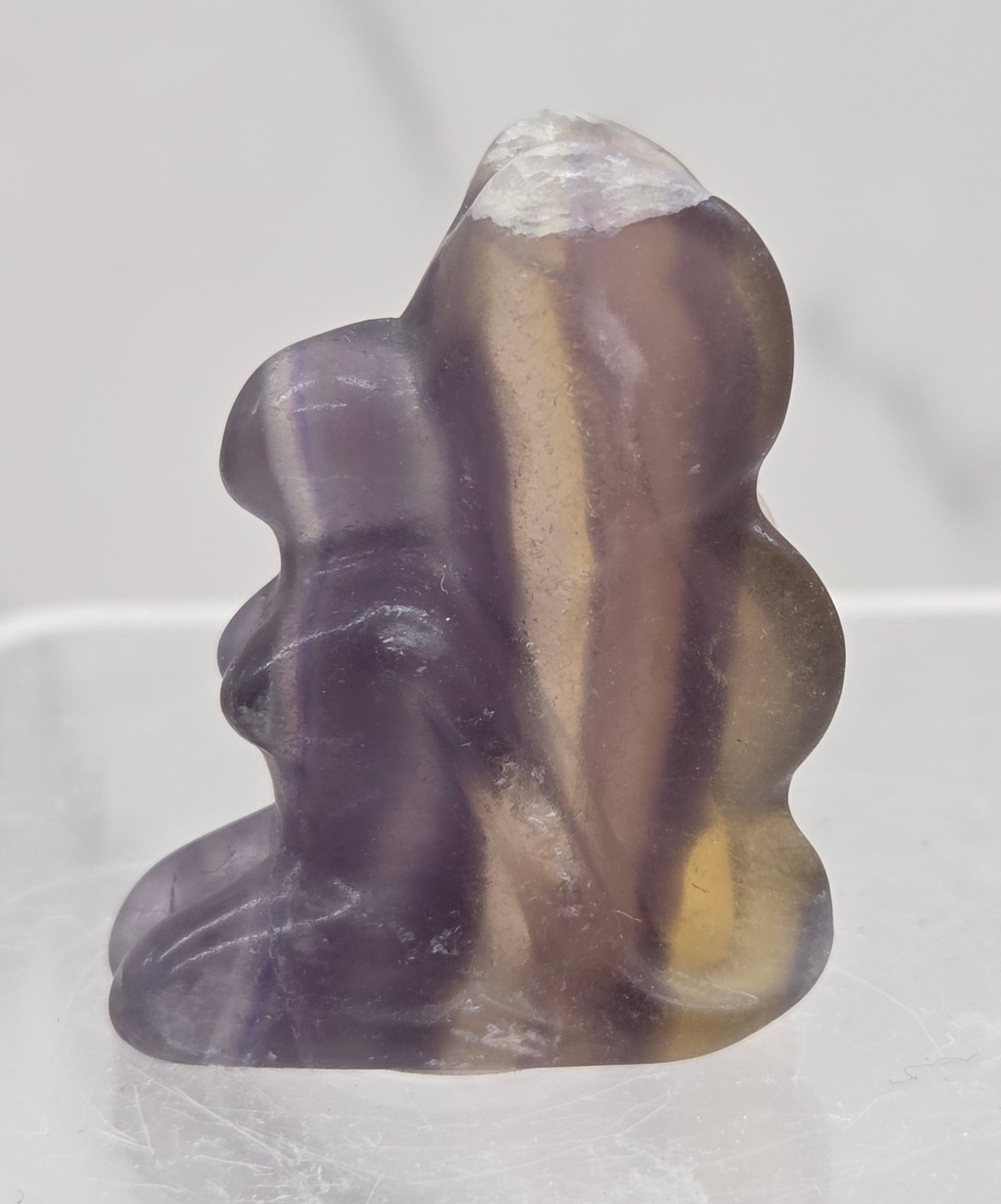 Fluorite crystal fairy carving on a white background