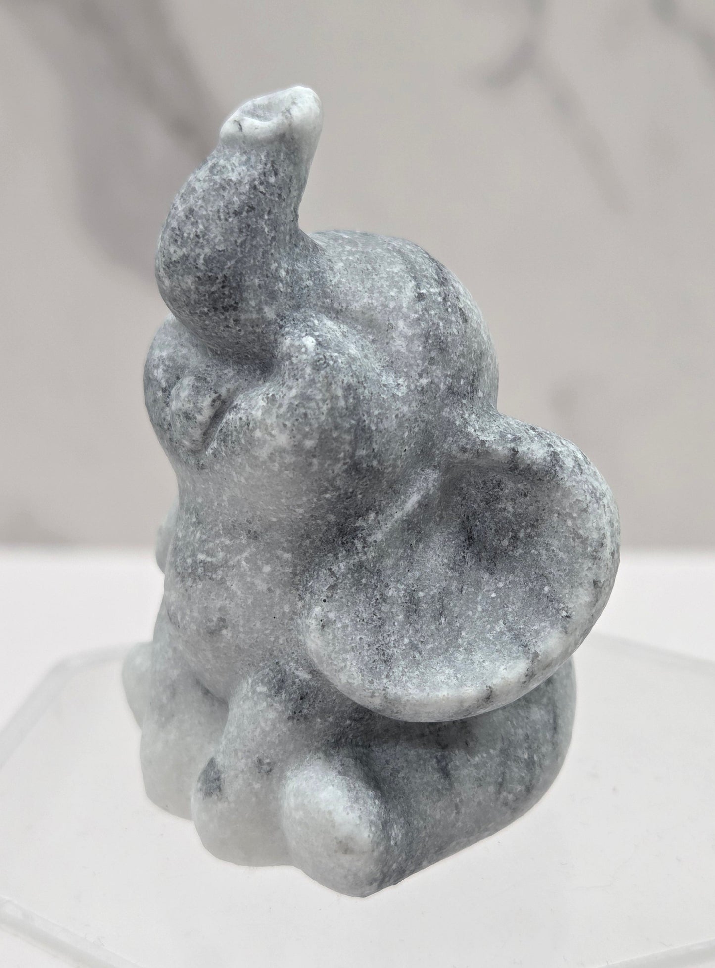 Decorative tai chi jasper sculpture of an elephant on a white background
