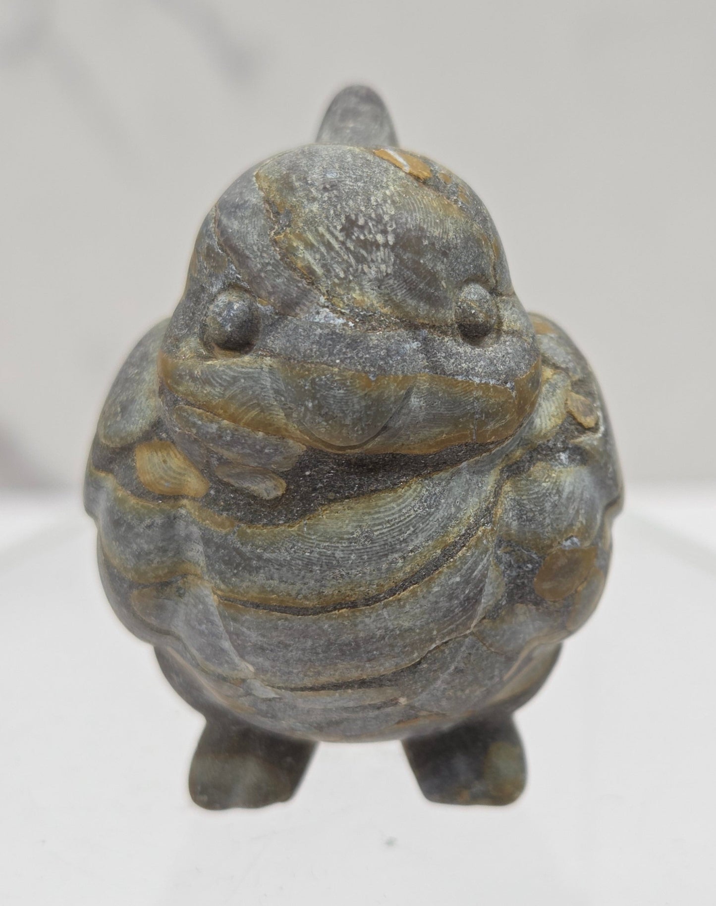Decorative bird carving made of Bamboo Jasper on a white background