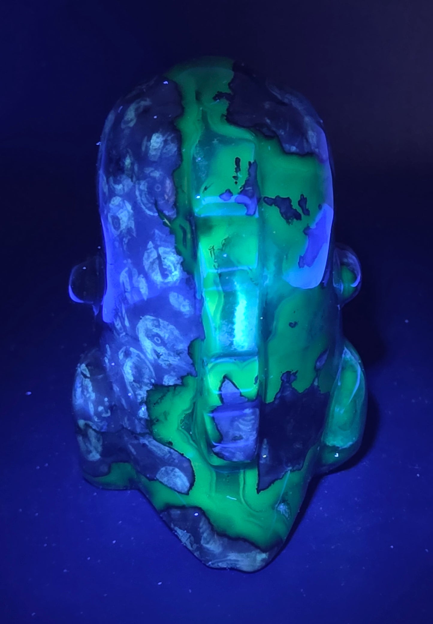 Volcano Agate cute dinosaur like carving under UV light
