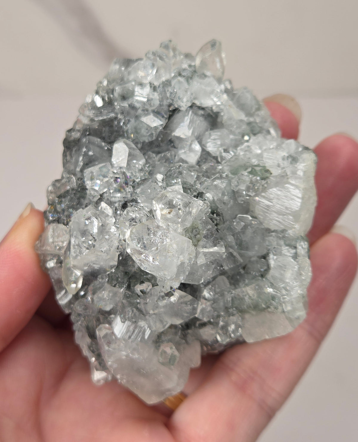 Apophyllite specimens with translucent, clear crystals on a grey crystal matrix