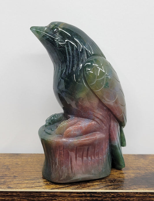 Colorful Ocean Jasper bird carving  in colorful green, pink and light green.