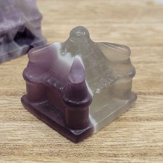 Fluorite castle carving with purple and white patterns