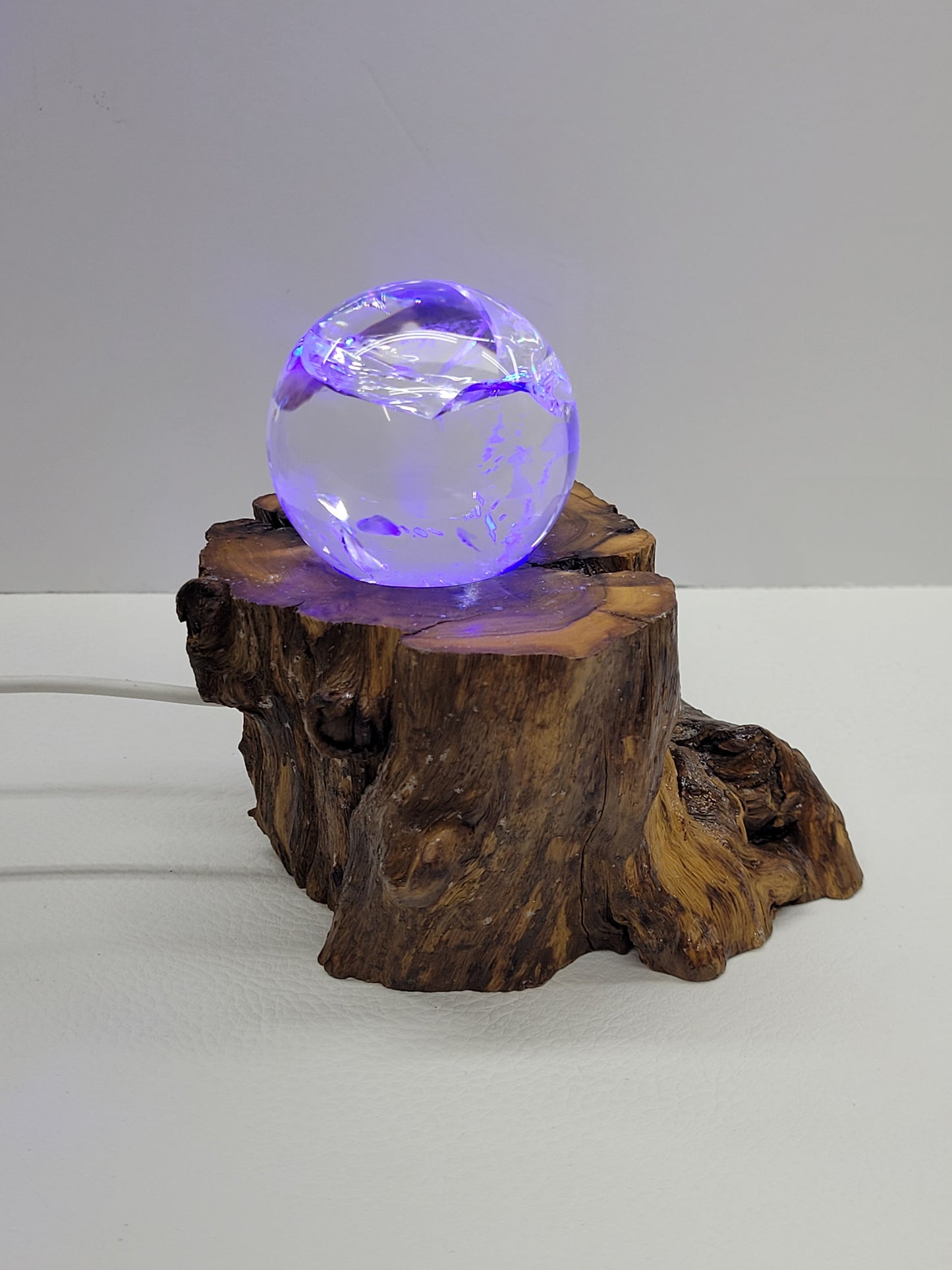 Wood stump lighted sphere stand