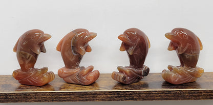 Carnelian dolphin carvings