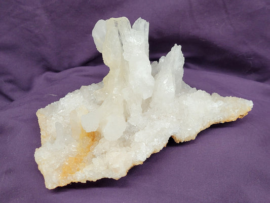 polished white calcite crystal specimens with varying forms 