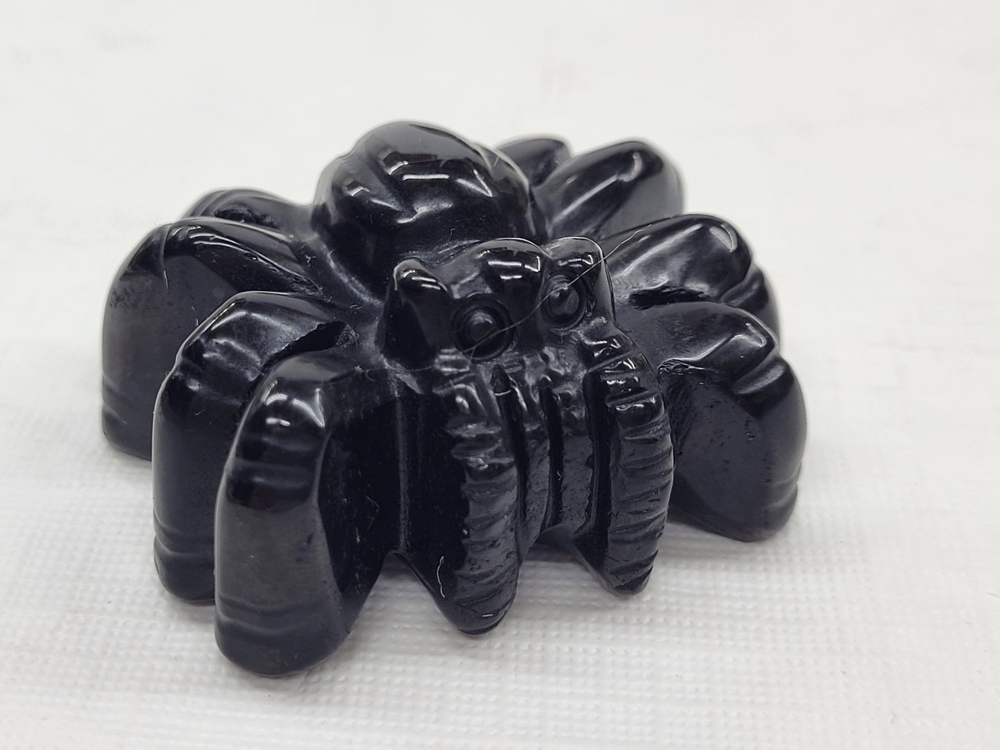 Obsidian spider carvings