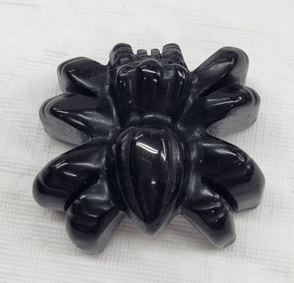 Obsidian spider carvings