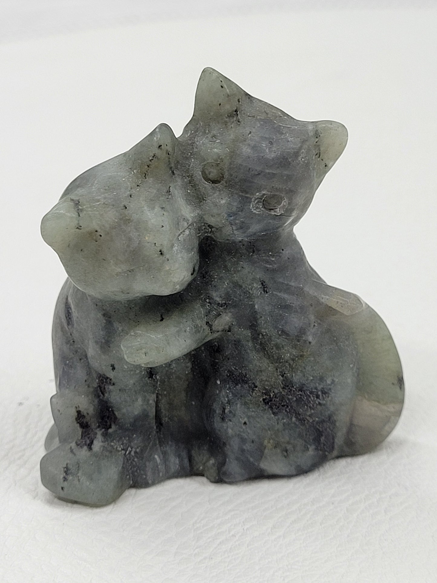 Hugging cat carvings