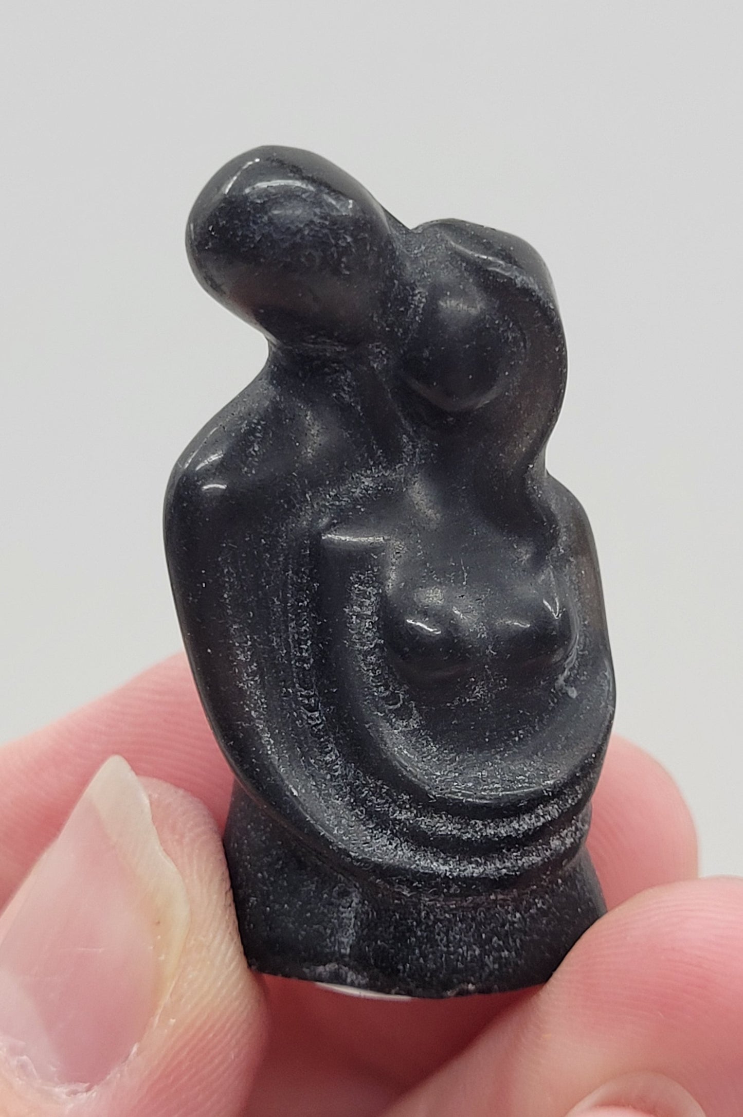 Hugging couple carving