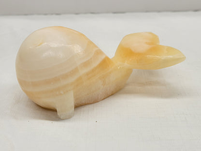 Calcite whale carvings