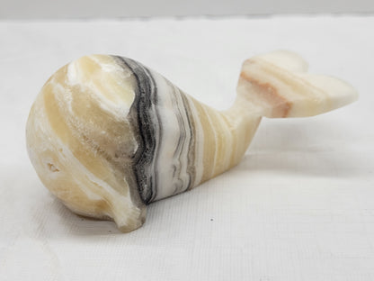 Calcite whale carvings