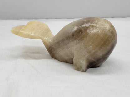 Calcite whale carvings