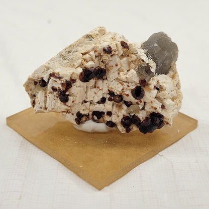 Garnet and Smoky Quartz on Feldspar