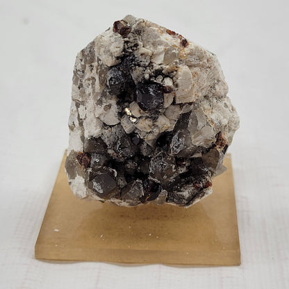 Garnet and Smoky Quartz on Feldspar