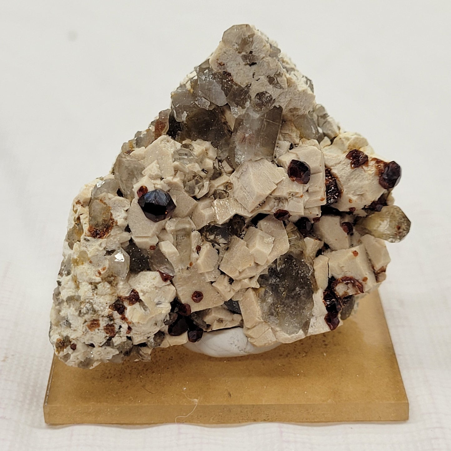 Garnet and Smoky Quartz on Feldspar