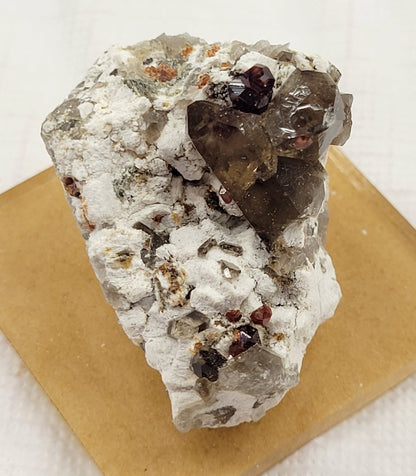 Garnet and Smoky Quartz on Feldspar